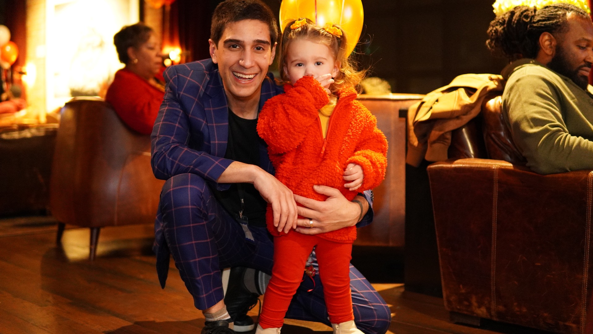 Ainsley at the Inside The Huddle Super Bowl Party… family on the floor.